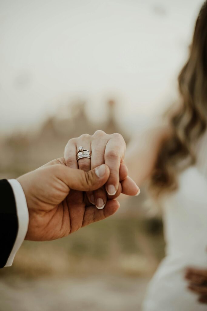 Bride holding a male hand